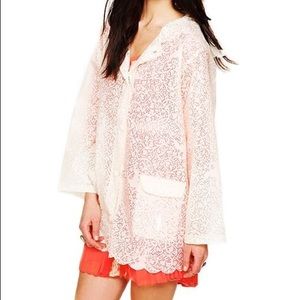 Free people lace looking rain coat.